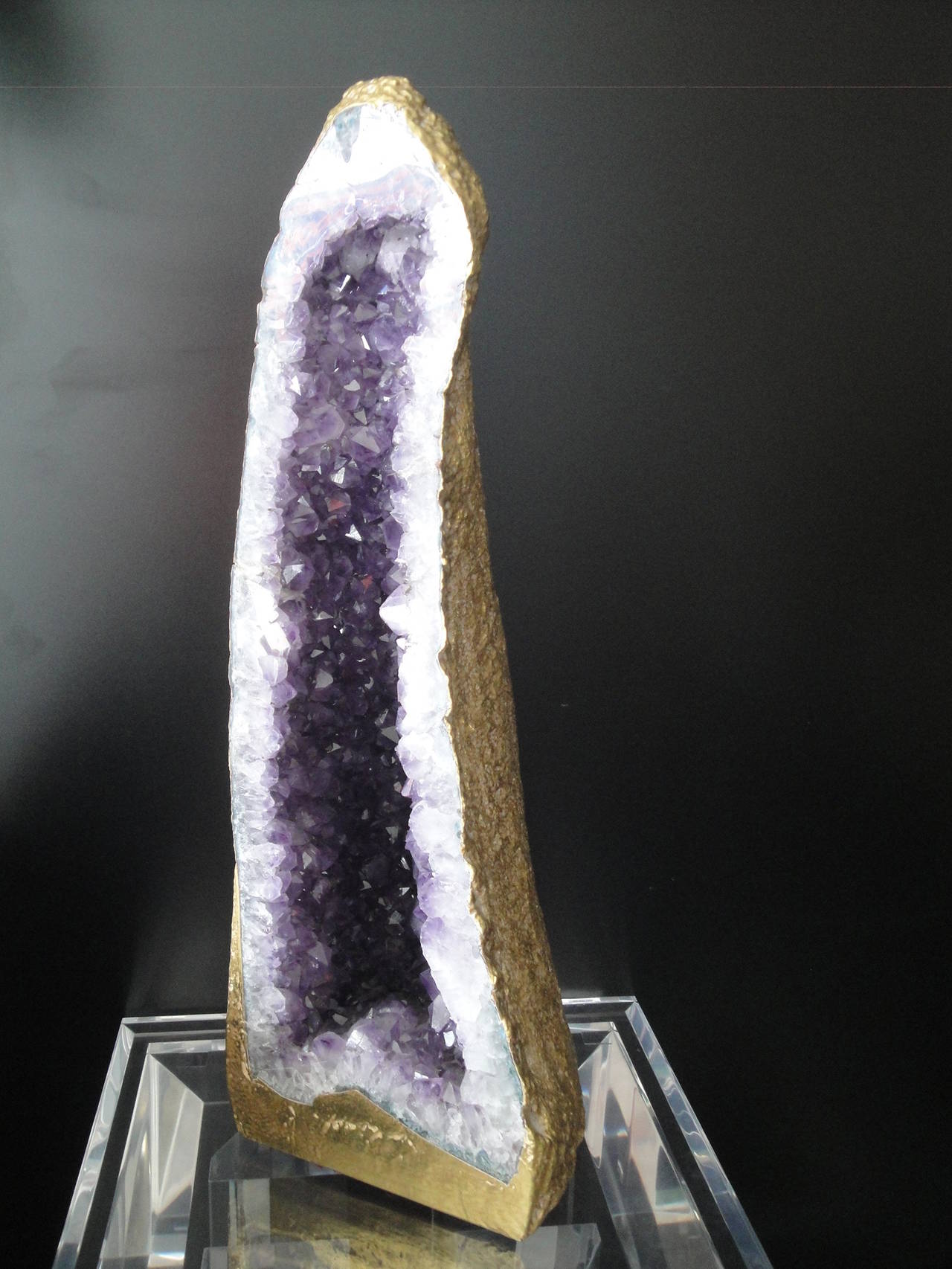 Decorative amethyst geode in 22-karat gold leaf
Shows a old internal repair not very visible to photograph.

Offered at Gallery Girasole.
