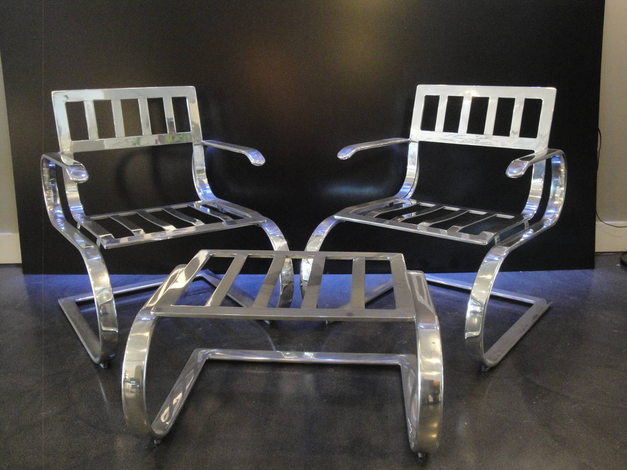 American Pair of Aluminum Lounge Chairs and Ottoman