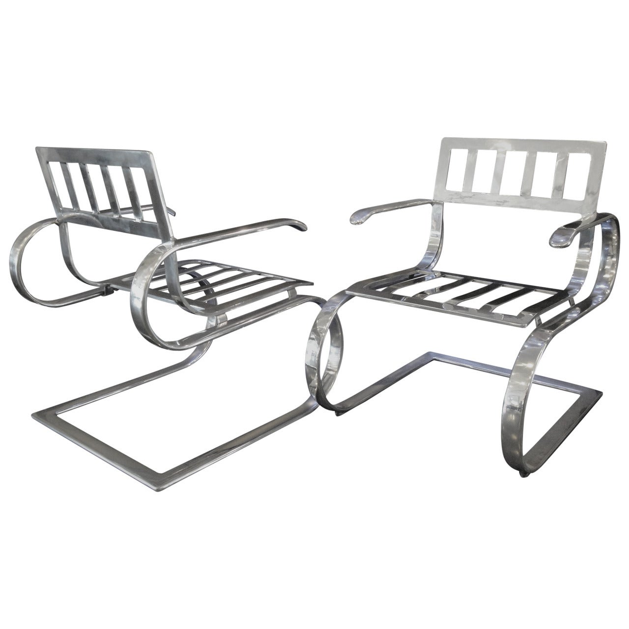 Pair of Aluminum Lounge Chairs and Ottoman