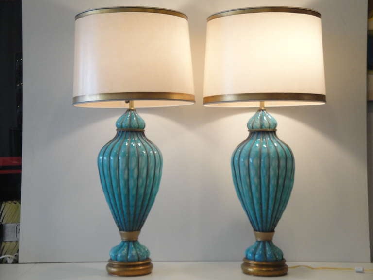 Pair of gigantic turquoise caged Venetian lamps by Marbro lamp Co. These absolutely beautiful lamps are mouth blown and are very impressive. Each lamp has two light bulbs and measures 41
