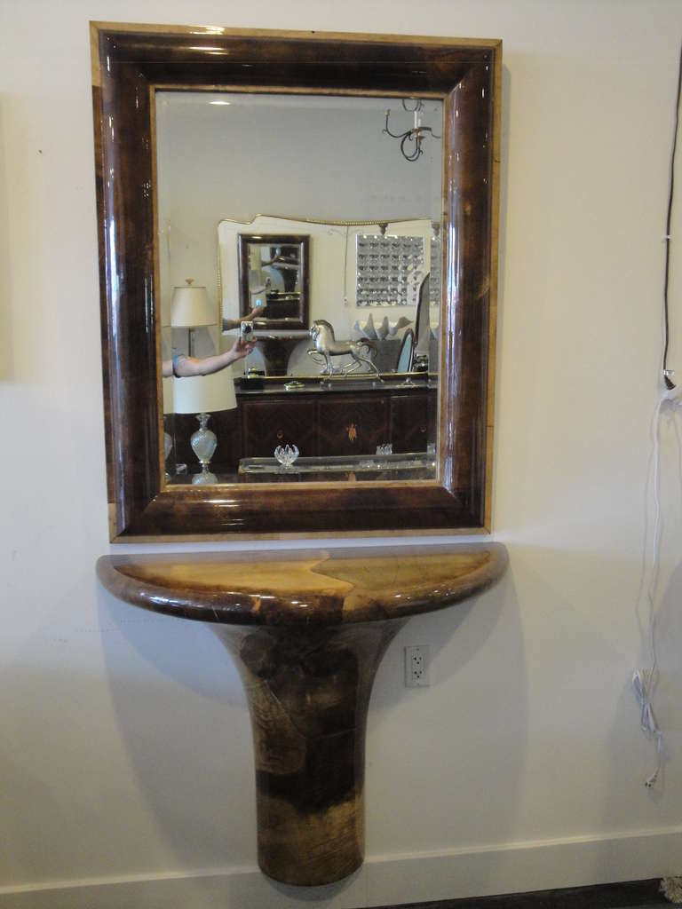 Karl Springer wall mount parchment console table with matching mirror.
Mirror frame is 38