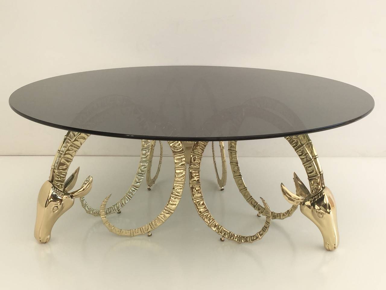 Brass ibex coffee table in the style of Chervet
Each base is about 17.5