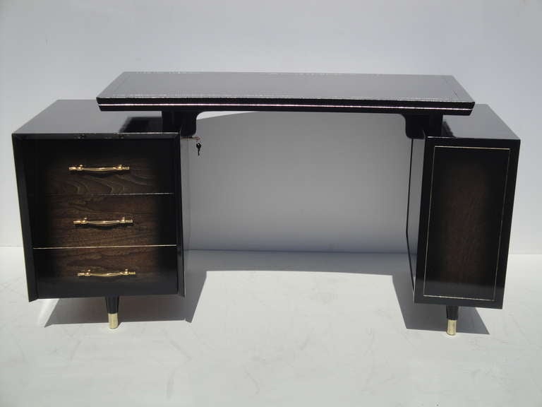 Mid century modernist walnut curved desk with floating top in high gloss ebonized and cerused finish.
Right side has one small drawer and one big drawer for folders.
Left side is open bookcase shelving.
Floating curved top is 46 inches by 24 inches