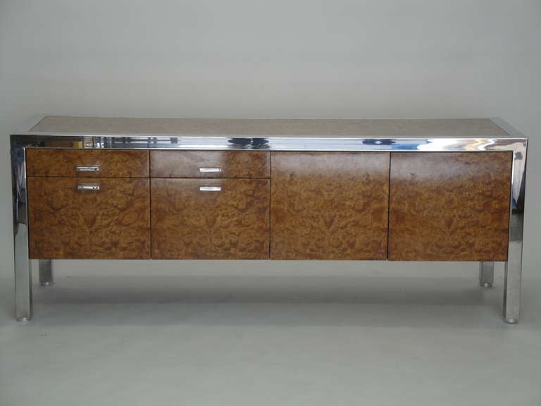 Gorgeous and rare Leon Rosen for Pace collection executive credenza made of bookmatched olive burl wood and chrome legs. Retains original label.