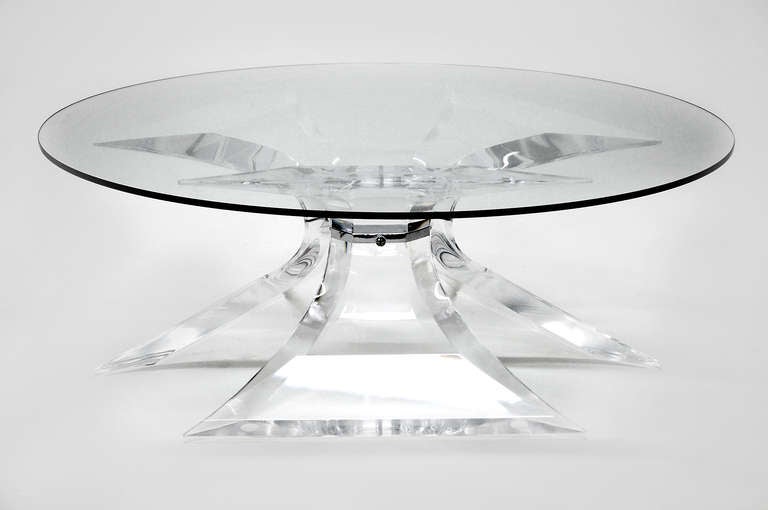  Lion in Frost Lucite coffee table with chrome center. Glass shown not included. Will hold round or hexagon glass top. We also have same table with brass center connector.

Offered at Gallery Girasole