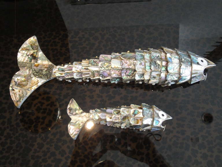 Pair of abalone shell fish sculptures bottle openers in the style of Los Castillos

The approximate lengths are 15" and 7"