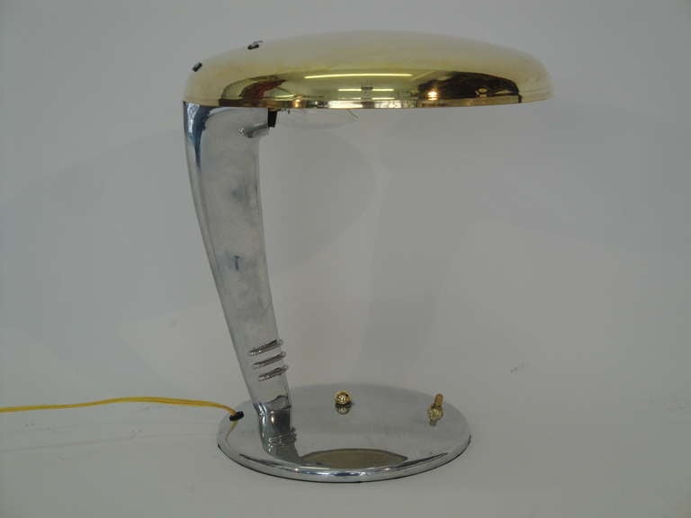  Streamline art deco cobra lamp by Faries. 
In original condition with brass lampshade and polished nickel base.