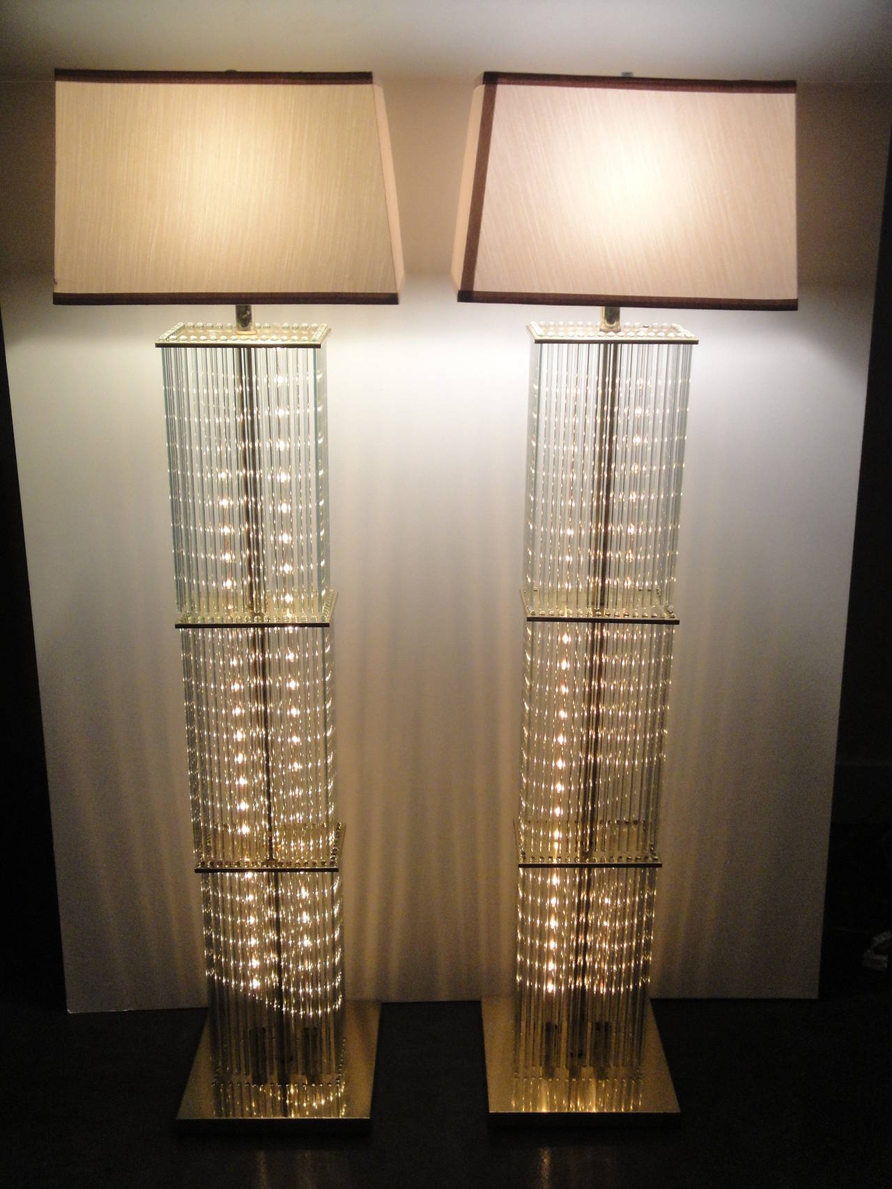 Pair of Sciolari brass and glass rods floor lamps for Lightolier. Original light bulbs have been replaced with new LED pipe bulbs that will last a lifetime.
Shades not included.