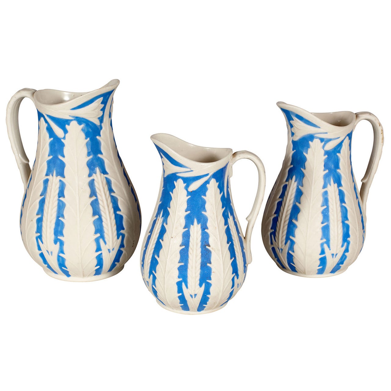 Set of Three Parian Porcelain Pitchers