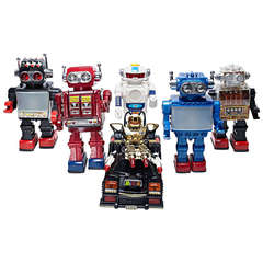 Group of Vintage Toy Robots with Original Packaging