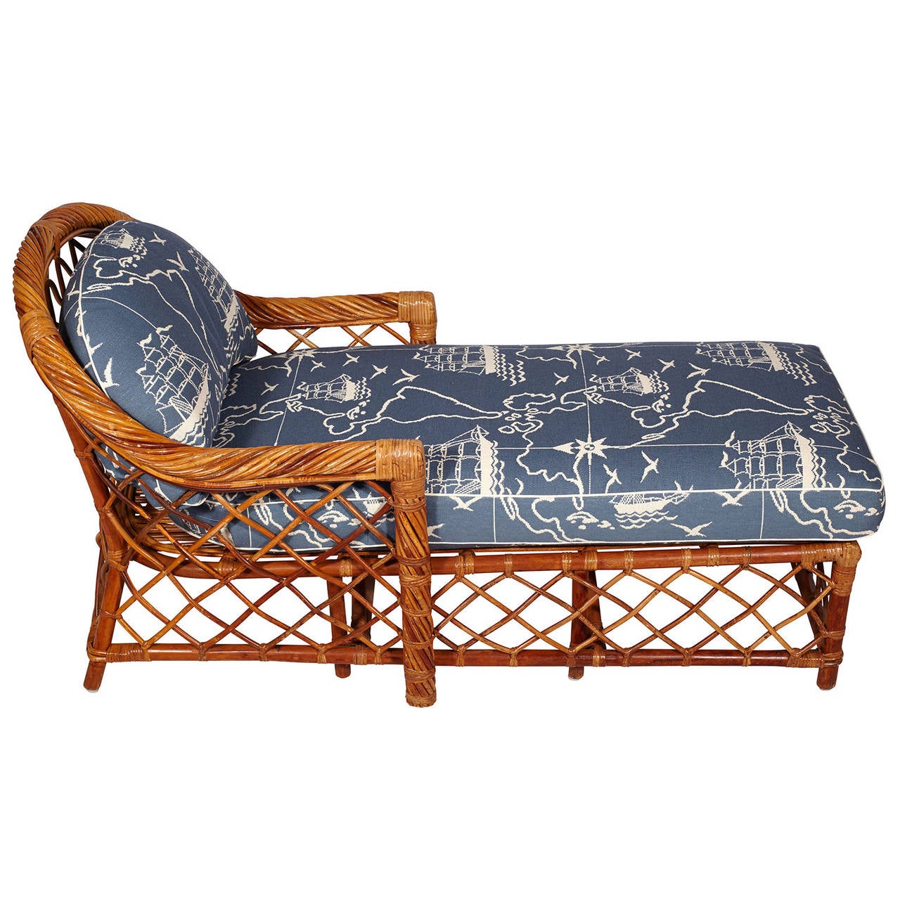 A mid-century woven rattan and bamboo chaise lounge by the Bielecky Brothers. Back and seat cushion are newly upholstered in a nautical map print.