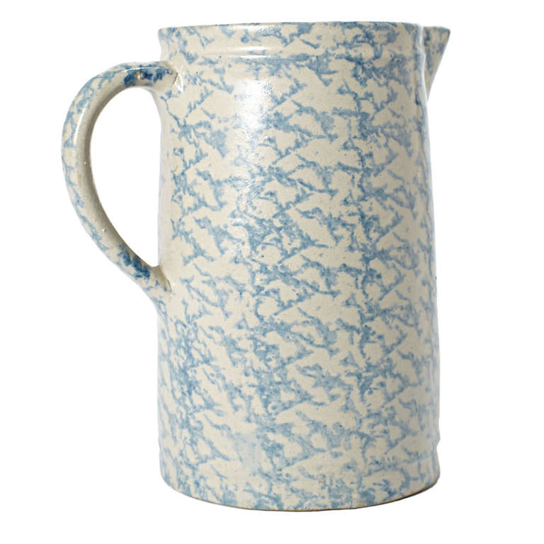 A spongeware pitcher with a wide mouth and body and blue and white sponge pattern.  American, circa 1930s.