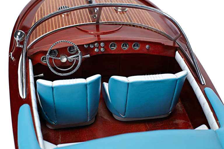 Mahogany Riva Aquarama Boat with White and Turquoise Seating