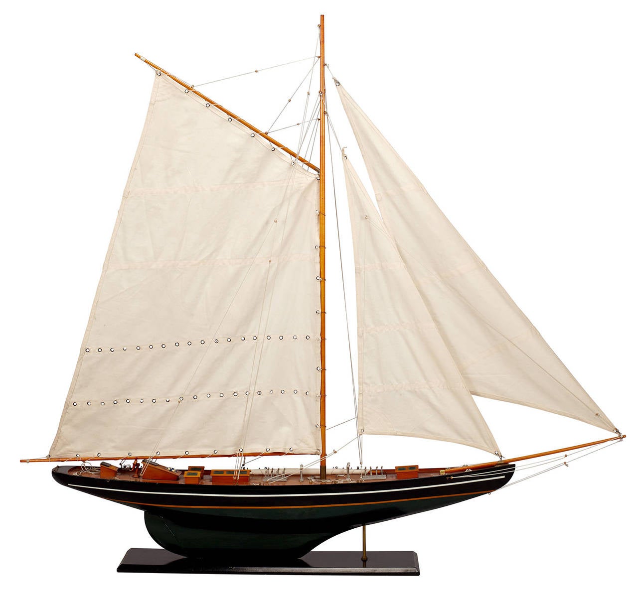 A large model of a sailboat or schooner on a wood stand.