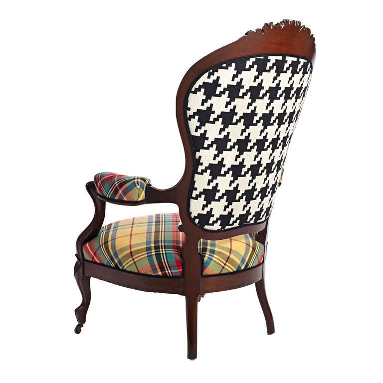 A beautiful Victorian mahogany armchair newly upholstered in yellow tartan with a black and white houndstooth back.  American, last quarter of 19th century.