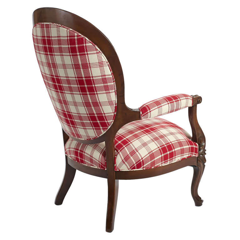Victorian, oval back armchair in a walnut frame and newly upholstered in red and white plaid fabric. American, late 19th century.