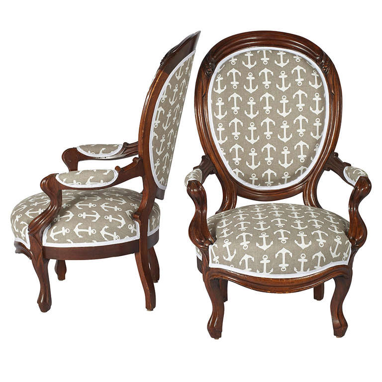 A pair of Victorian Oval-Back Mahogany Armchairs newly upholstered in Anthony Baratta Anchor Print Linen.