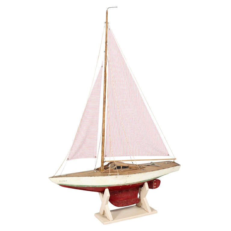 Pond Yacht with Red and White Sear-sucker Sails. 