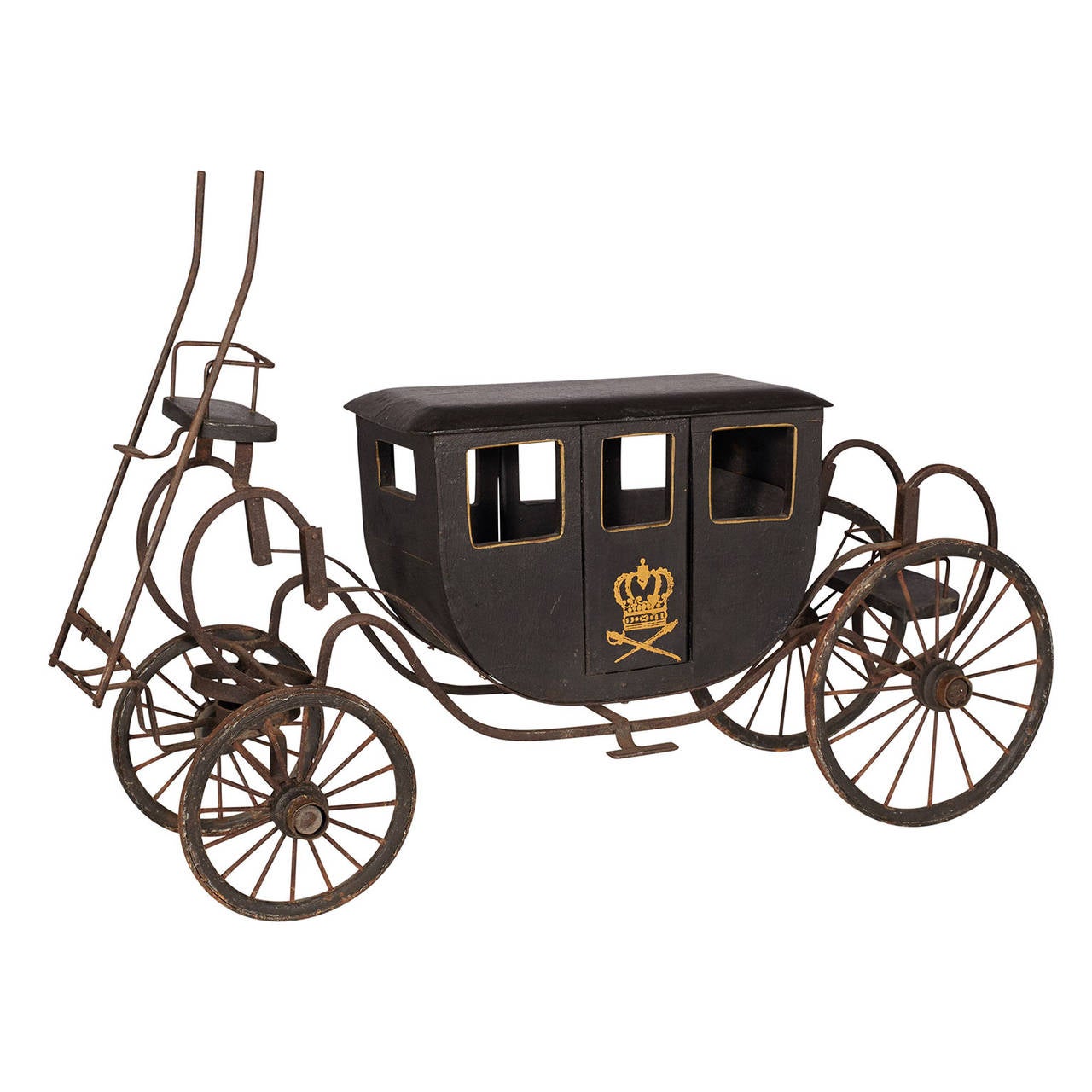 A metal model of a royal coach. Gold detailing on both sides.