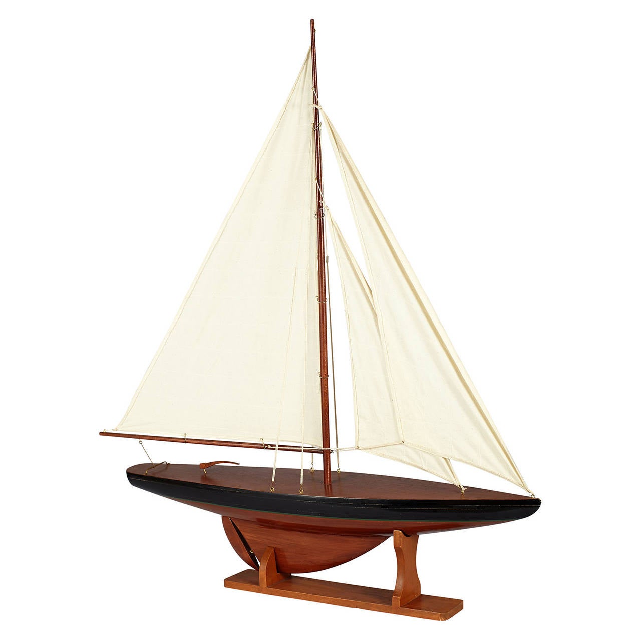 A two head model sail boat on a display stand.