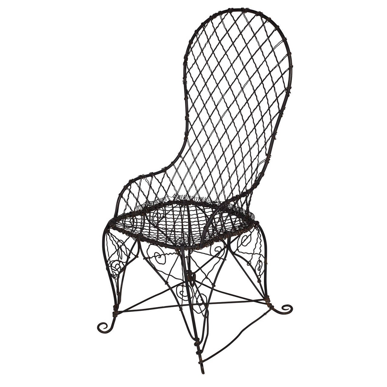 Beautiful antique black bent wire garden chair.