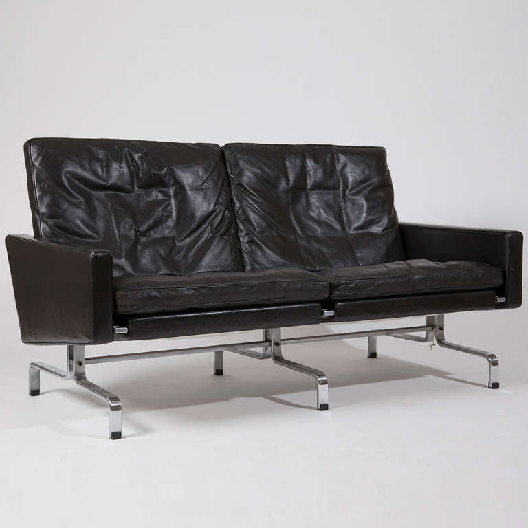 Two-seat black leather sofa, designed in the 1950s. Early piece produced by E. Kold Christensen, Denmark. Original leather.