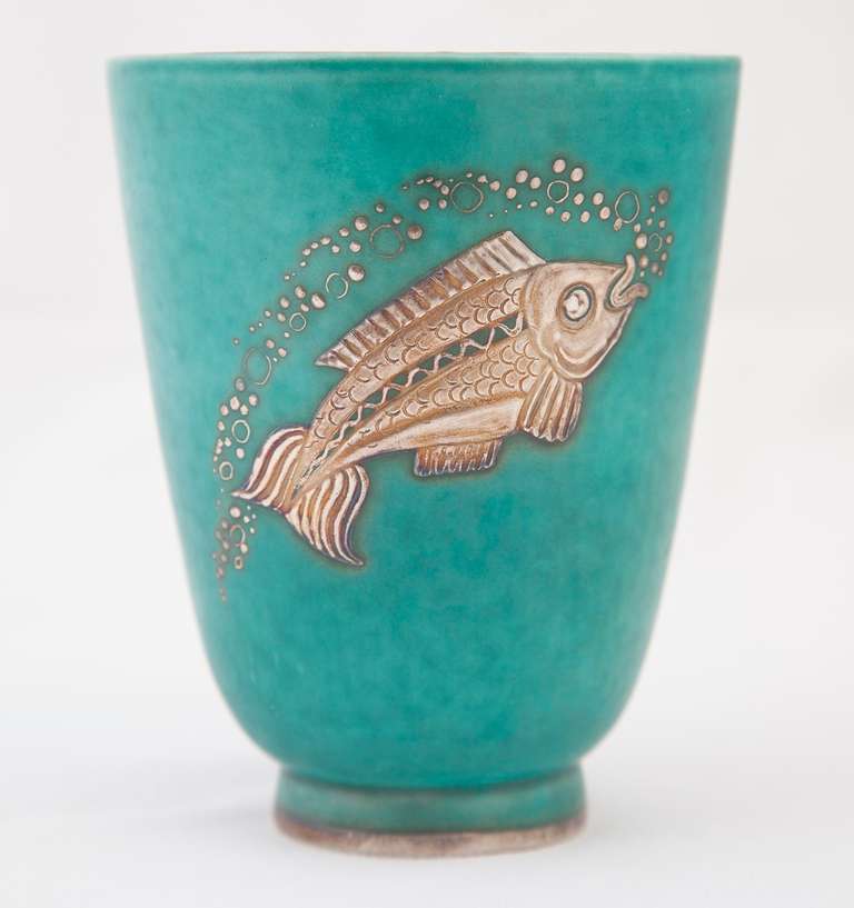 Stoneware vase with turquoise glaze and silver appliqué.
Stamped 