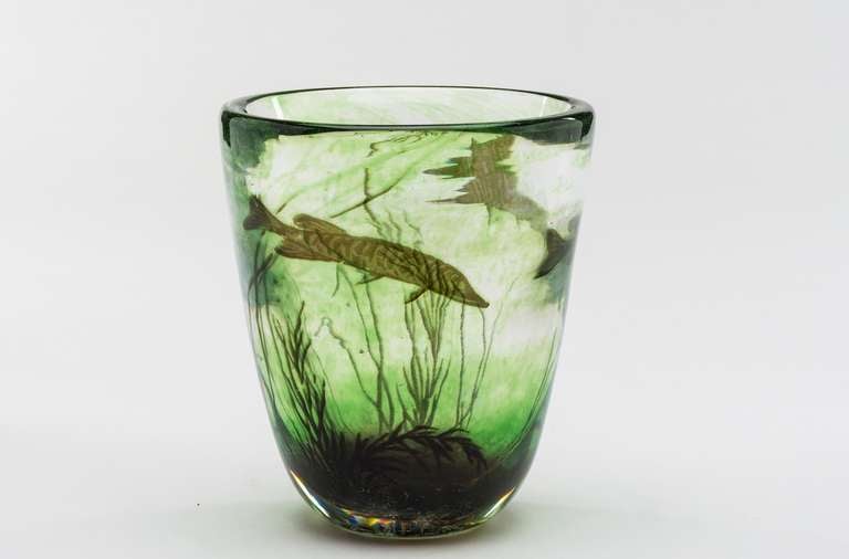 The Fishgraal was designed by Edwald Hald and produced by Orrefors in 1937; this was the first year of production for this kind of vases. It is decorated with the images of pikes.
Hald was a Swedish painter, graphic and first and foremost