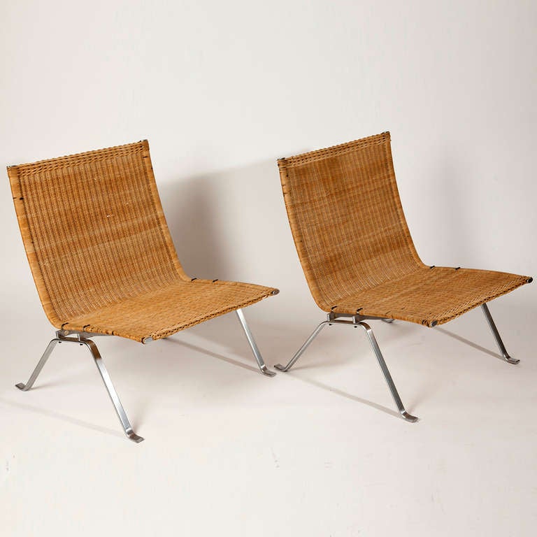 PK 22 Wicker and Brushed Steel Chair by Poul Kjaerholm for E. Kold Christensen designed 1951.
The PK22 lounge chair by Poul Kjaerholm combines simple and clean lines in a unique elegant profile. He designed this chair for his final exams at the