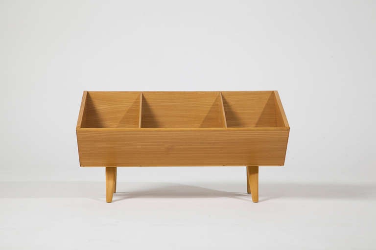 A small bookshelf, designed by Bruno Mathsson for the producer Karl Mathsson. Ash and laminated wooden legs. 
Manufacturers marks, dated 1976.
A small, delicate and rare piece of furniture.