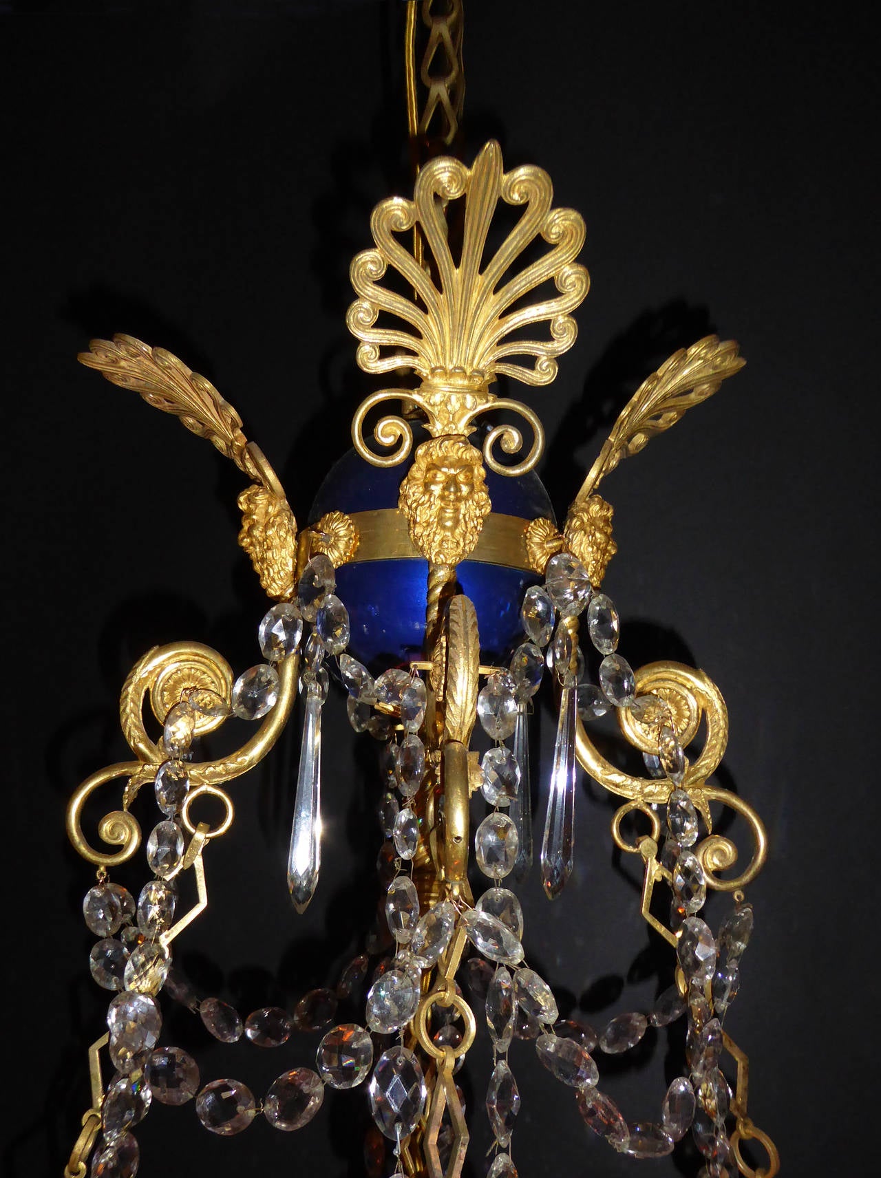 With blue corona, overall decorated with gilt bronze swans necks, palmettes and grotesque masks.