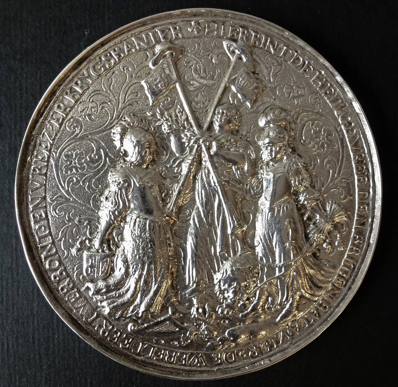 Maker's mark of Wouter Muller
Amsterdam, circa 1654

One side depicting the treaty of Westminster, decorated with arabesques against matted ground depicting three women: Brittania holding a coat of arms in one hand and a flagpole in the other