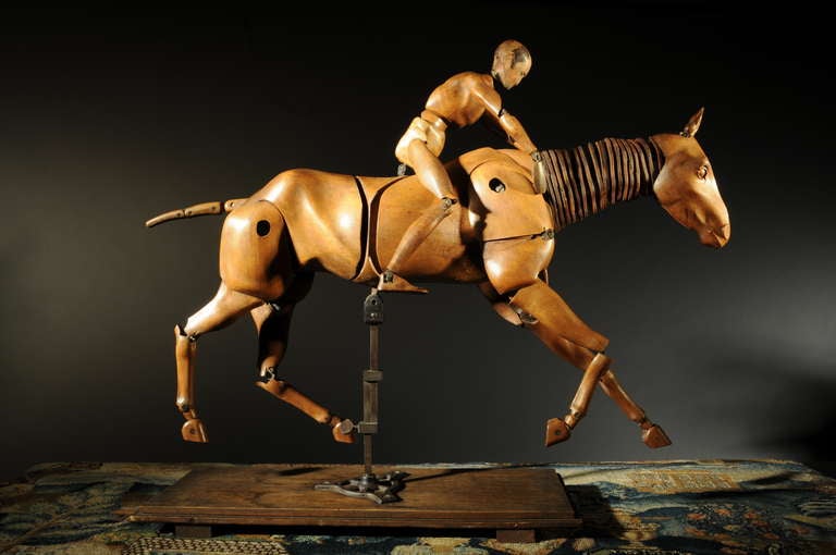 oval maker's mark: Maquette Francaise sur Armature Articulee, Paris B Deposee Brevettee SGDG.

The face of the rider has later been painted, probably in the early 20th century.

For a comparable artist model see: 
Sothebys, The Robert and