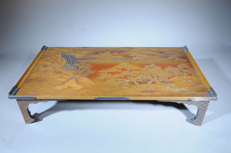 square, finely decorated with a waterfall in a mountainous landscape with trees, set with silver mounts with floral relief against matted ground, on four shaped legs.

Provenance: 
Former collection of the late Queen Juliana of The Netherlands