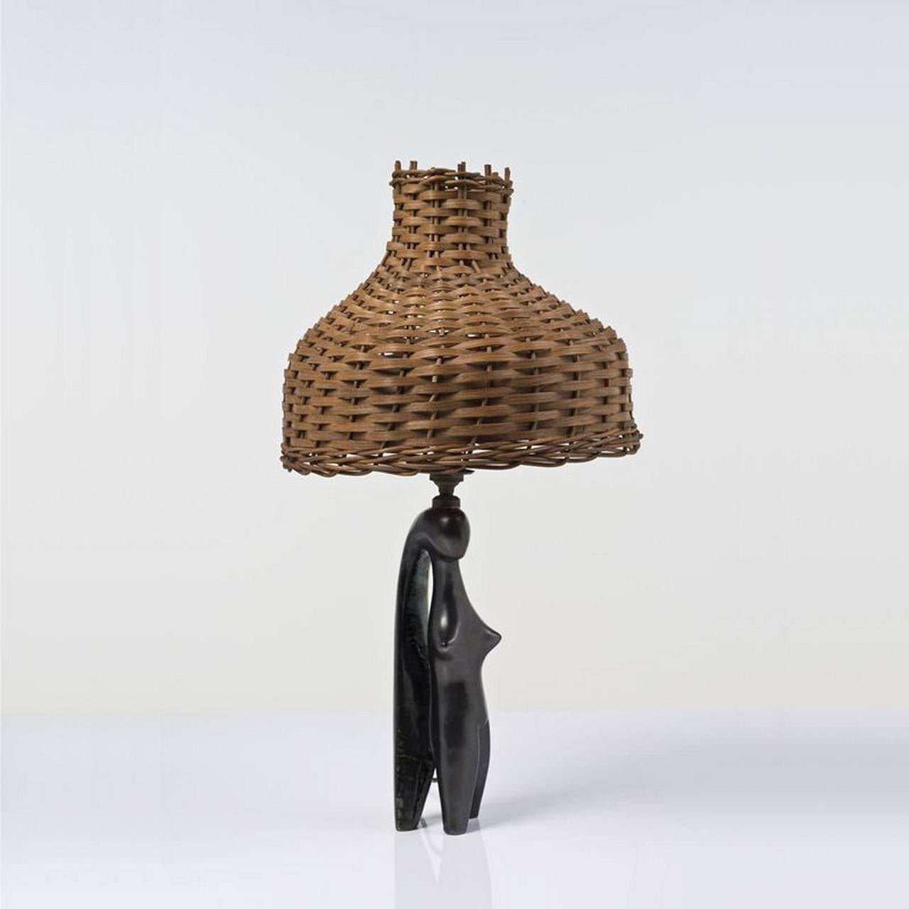Black enameled ceramic table lamp in female form by Jacques Blin (1920-1955). France circa 1960s. H 58cmx 33cm.