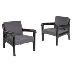 Pair of Leather Clad Armchairs by Jacques Quinet