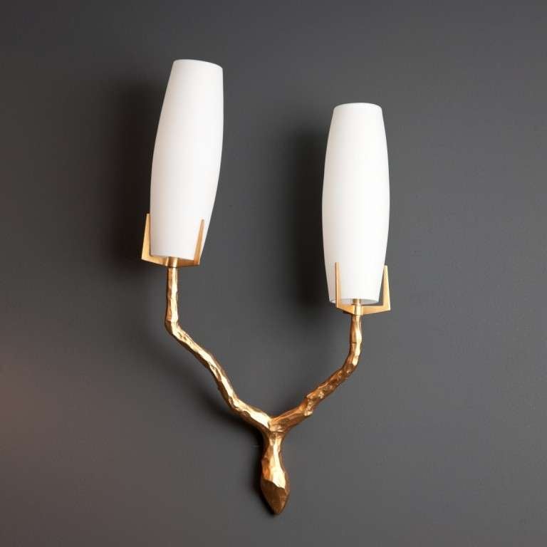 Pair of gilt metal wall sconces by Arlus with opaque glass shades.
