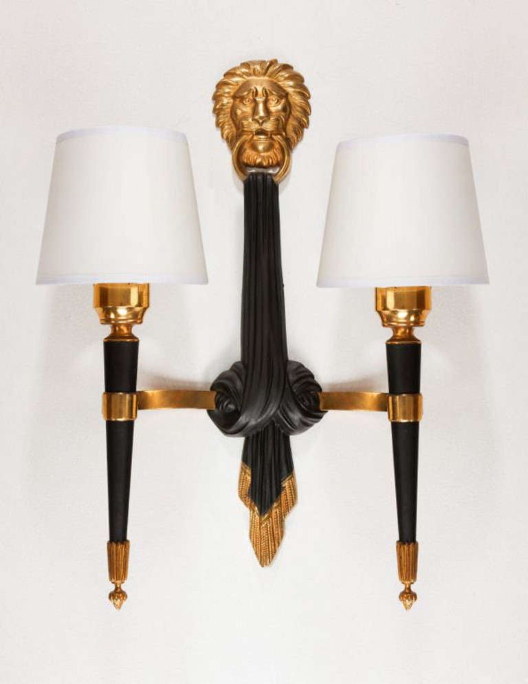 Pair of large wall sconces in Neo-classical design in black lacquered metal with brass detail.
Item location London
