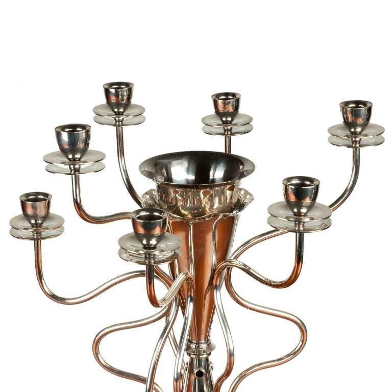 Silver plated candlestick, decorated with seven candleholders and a removable central area. The conical shaped base is decorated with holes. Hallmark to the base. Circa 1989, Prague.

Biography. Boris Sipek was born in Prague, Czechoslovakia in