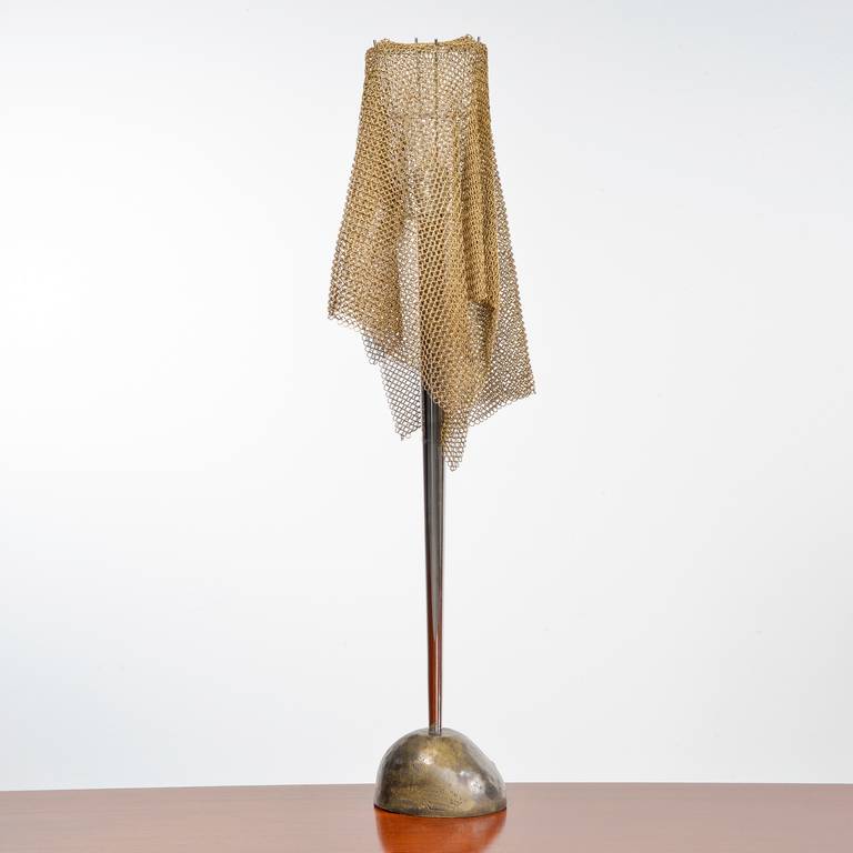 Unusual table lamp in bronze with chromed metal stem and brass chain mail shade. Designed by Toni Cordero for Artemide, Italy, circa 1990. Height 83.5 cm, Width 17 cm.
