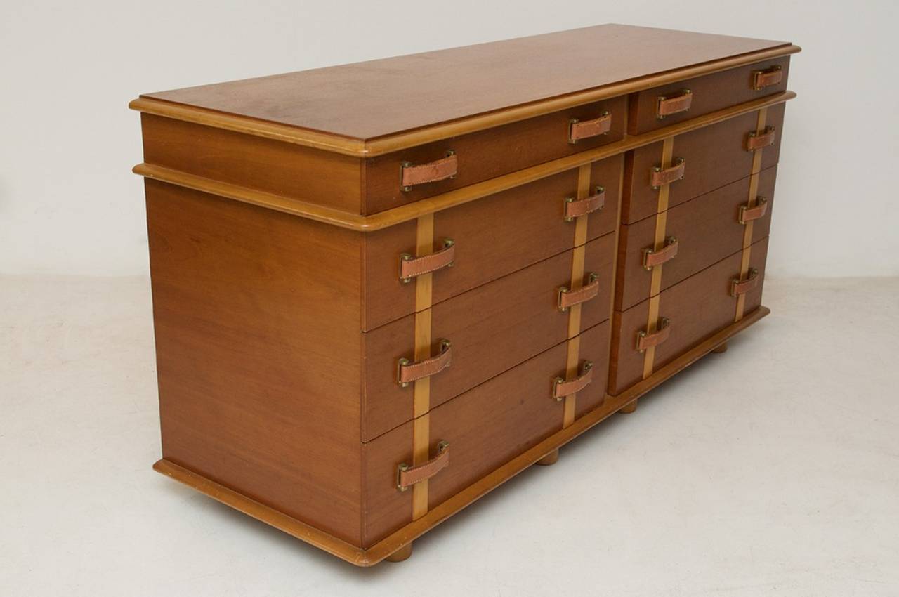 Cabinet with eight drawers in mahogany and maple with leather handles, Model 'Station Wagon'  designed by Paul Frankly for Johnson Furniture Company.