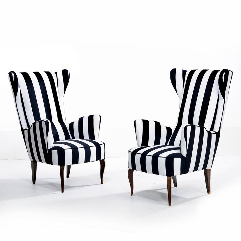 Pair of Italin club chairs re upholstered in striped cotton, with polised wooden legs. Italy circa 1950s.