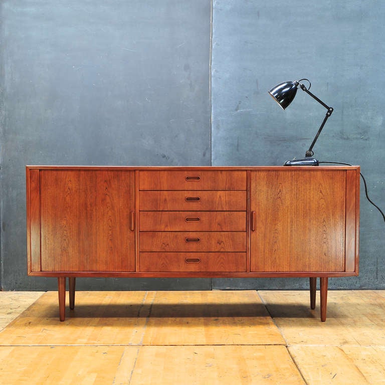 Denmark, c.1950s. Arne Vodder Teak Danish Mid-Century Tambour Door Sideboard Credenza. Rich Deep Hued Patina. High Quality Workmanship Edging Details, Dovetails, Mitred Joinery. Very Good Vintage Condition.

W: 67 x D: 18½ x H: 32 in. *(Tambours