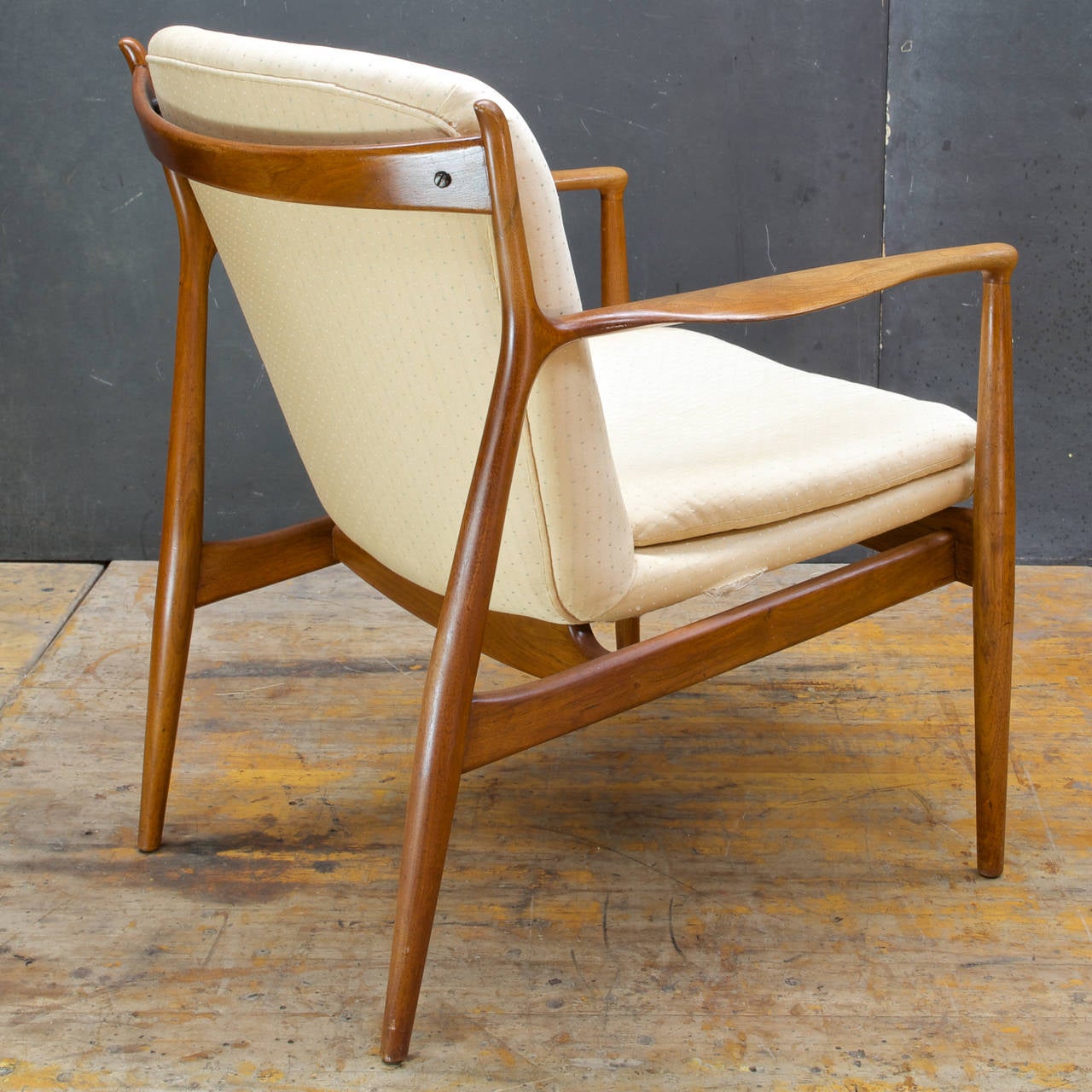 Rare and collectible (Never Reproduced) chair design by Finn Juhl. In the original upholstery with original seat pillow.