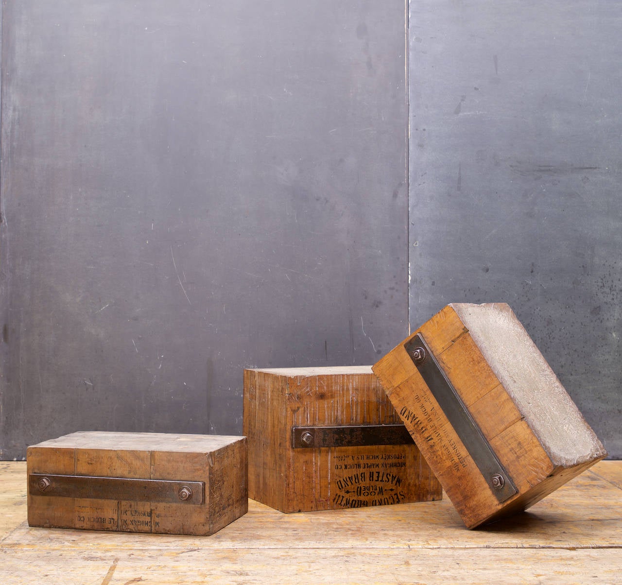 USA, c.1910s. A set of three, solid staved Maple and Iron butcher blocks used for hammering leather crafts. Roughly 50-90 lbs. each.

Small block W 18.5 x D 12.25 H 7.75 in.
Medium block W 18.25 x D 12.20 H 11 in.
Large block W 18.25 x D 12.25 H 14