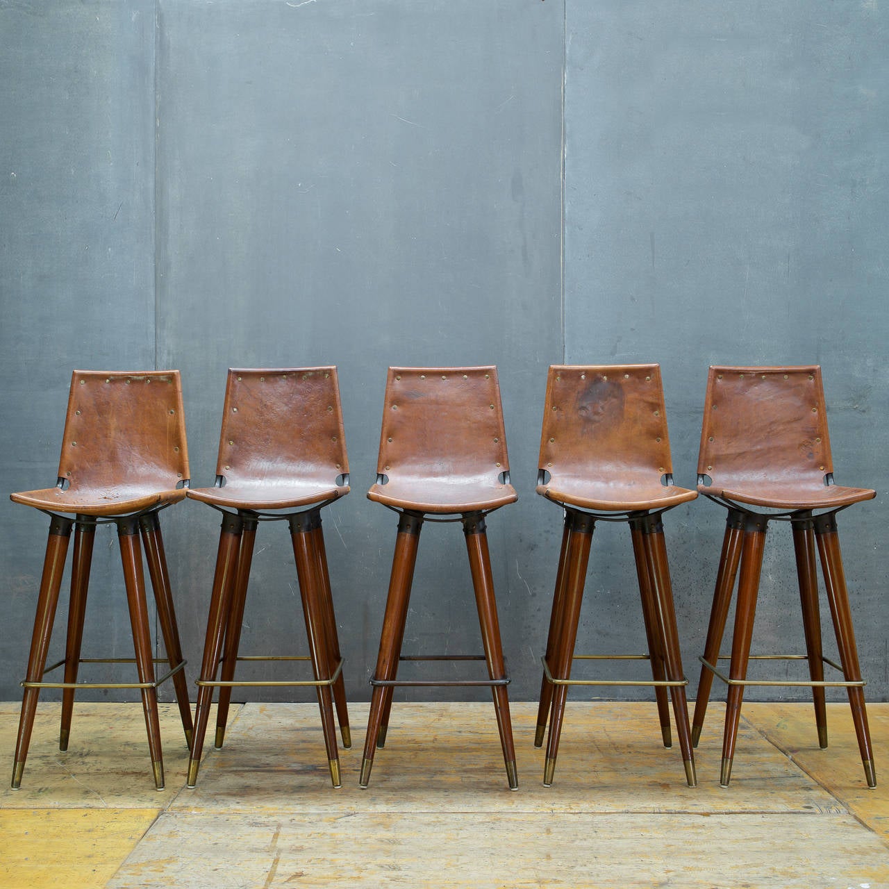 Tall and sturdy bar stool design, but the chair seats are narrow, and can be uncomfortable for wider hips and taller folks. Form in the manner of Perriand, Pearsall, or Leathercraft.  Documented Designer or Maker is Unknown, Made in USA most likely.