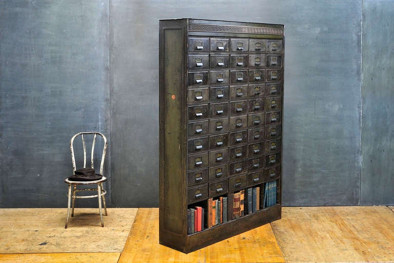 Victorian Bronze & Steel Vintage Industrial Apothecary Library or Office Records Self-Standing Wall Cabinet. Very Large in Scale.  Japanned Brass Pulls on Each Drawer.  Greek Key patterns in Cast Bronze, Iron Top, and Side Panels.  Book Shelf