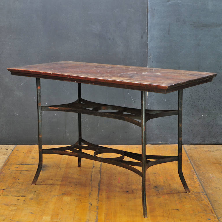 Rare vintage Industrial japanned finished steel and wood toledo work table. Appear to be all original with original hardwood work surface (top.) very good condition with minimal rust to steel, retaining some of the japanned finish.