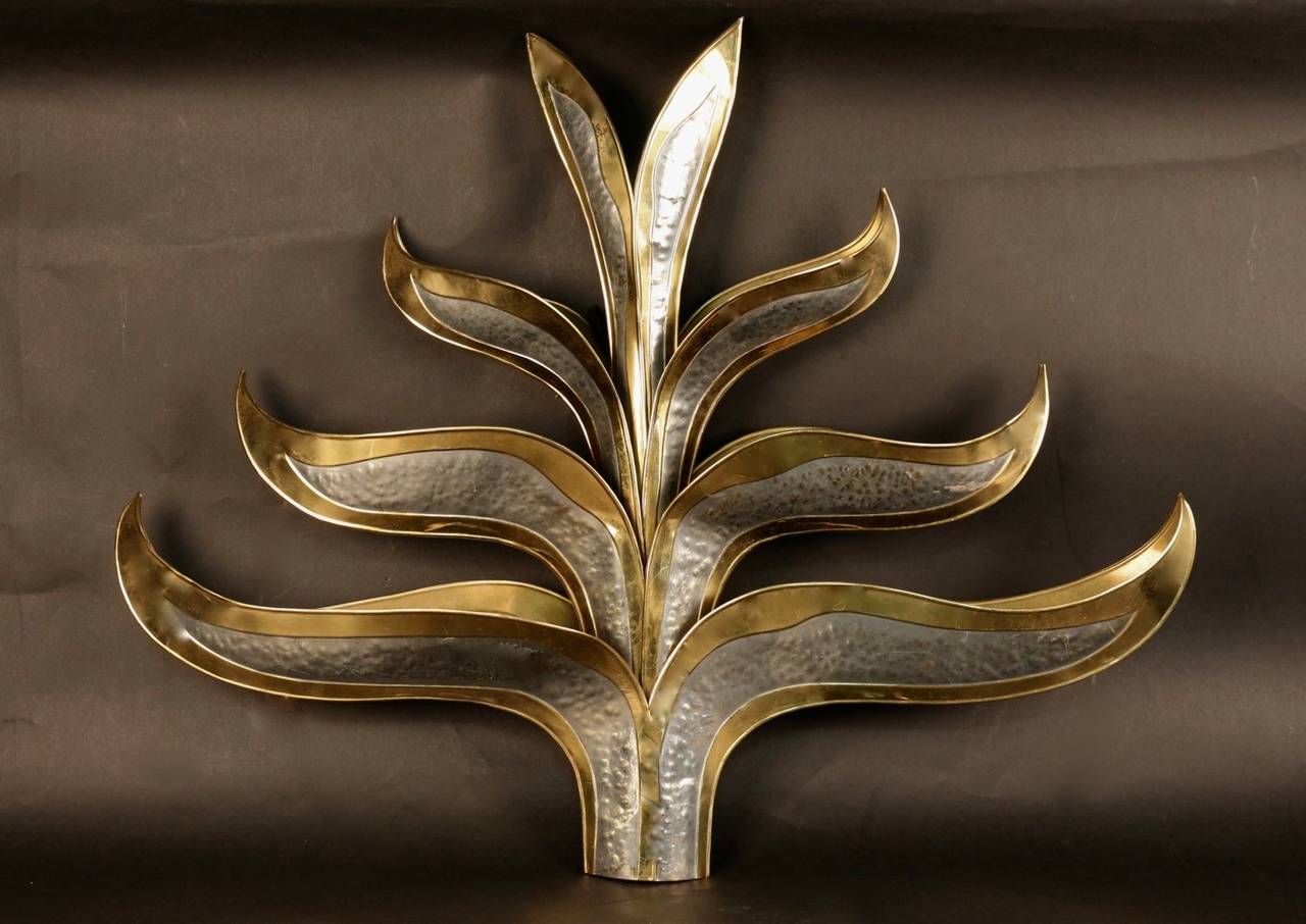 Large 1970's sconce by Richard Faure. Made of eight gilt and silvered brass leaves. Six bulbs hidden in the foliage.
