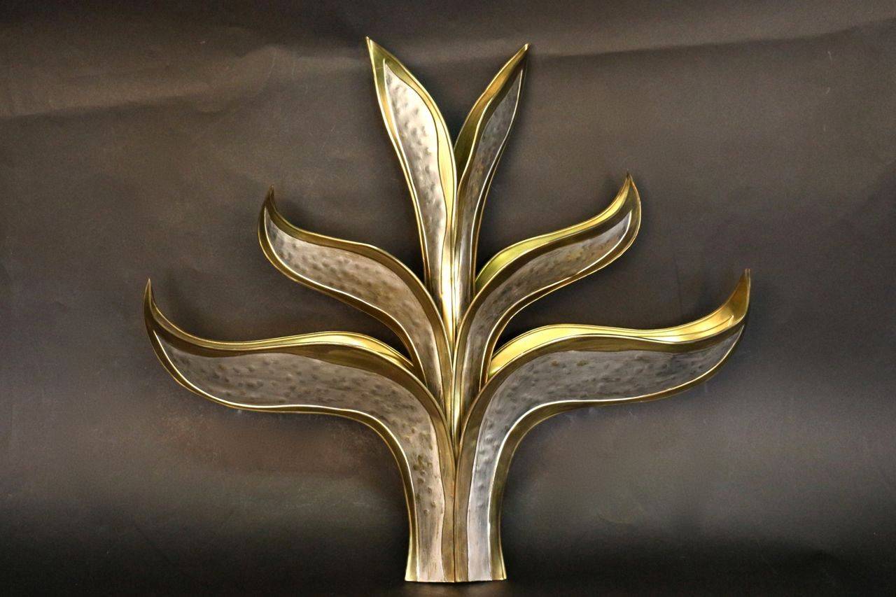 Set of three large 1970's 'Foliage' sconces by Richard Faure. Made of six gilt and silvered brass leaves. 
Four lighted arms hidden in the foliage.